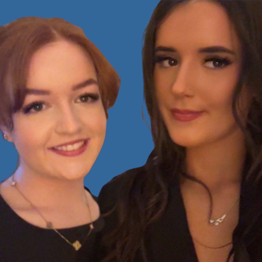 Two young white women stand side by side and are smiling