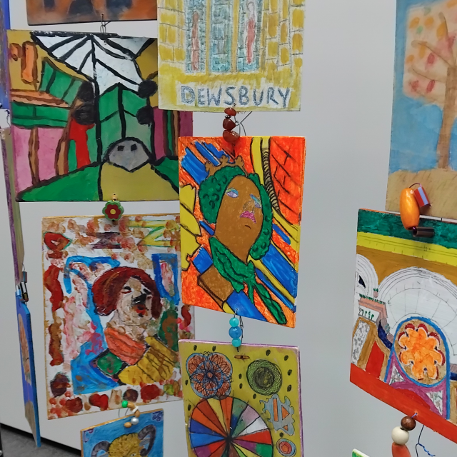 Paintings depicting stone carved faces, the arcade and Dewsbury Minster